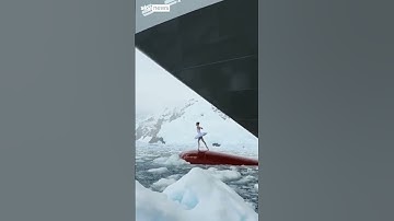 Thumbnail of Ballerina dances on top of ship's bow