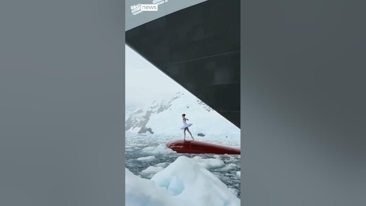 Ballerina dances on top of ship's bow Ballerina dances on top of ship's bow