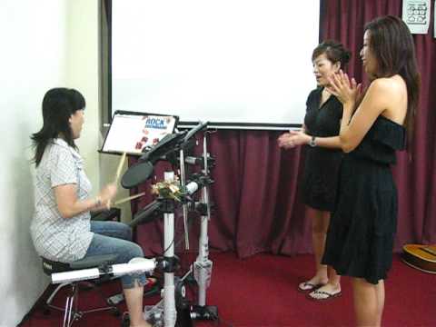 Irene Chan playing drum 2