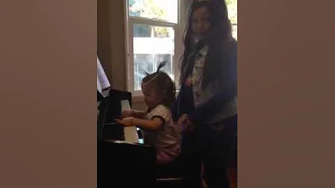 Kelly and Sophia play piano