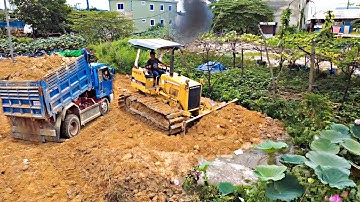 Landfill Flooded area! Dump Truck Unloading soil with Komat