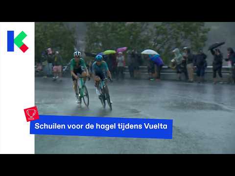 Taking shelter from the hail during the Vuelta