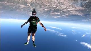 Duo of Skydivers Freefalls Above the Ocean - 1152956-10