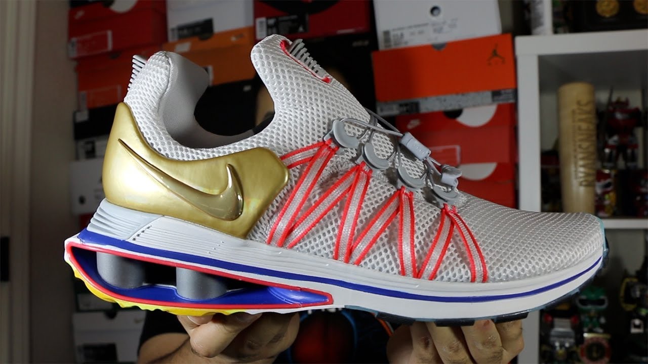 nike shox gravity metallic gold