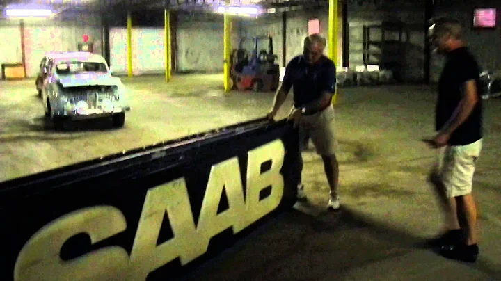 David Winstead gives Vernon Atterberry a Saab Sign