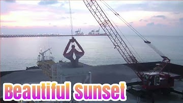 The Amazing Process of Unloading Limestone in the Sea Until Sunset