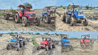 JCB 140NTX Machine loading mud in Mahindra arjun Novo RXSonalika and Powertrac tractor composition