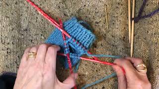 Starting a knitted mitten thumb