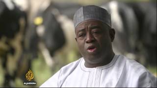 Oil slump driving inflation and currency drop in Nigeria