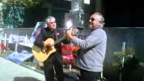 Fr Bill Ruth. Ramon Reyes de Union City sing at th...