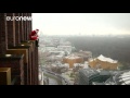Santa climbs Berlin skyscraper to surprise children