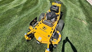 Training a guy on this Hustler Trimstar walk behind mower