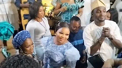 ADENIYI JOHNSON AND WIFE SEYI EDUN ON THE DANCE FLOOR AT THEIR TWINS NAMING CEREMONY