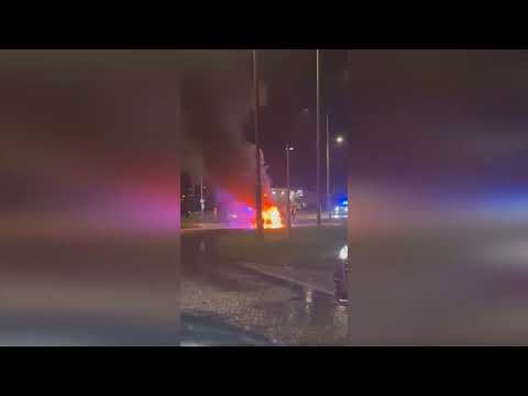 Shocking footage shows electric car in flames after allegedly crashing into petrol station