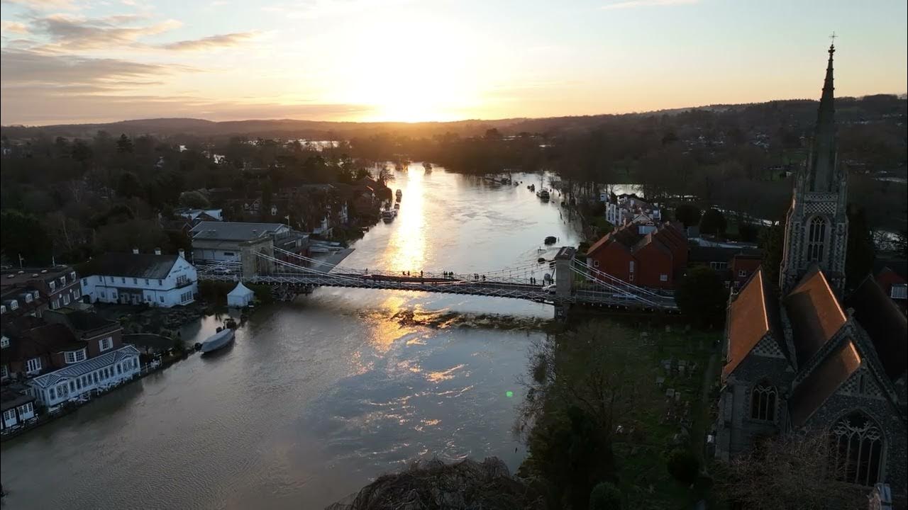 Flood in Marlow. Drone view of the bridge during sunset and the flooded
