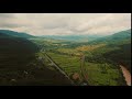 aerial view cars driving on country road and the hills btw0ltrz 7  D mp4