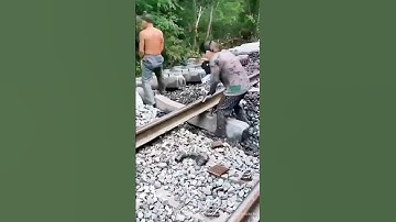 The labor of workers changing sleepers on the railway