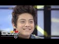 The Buzz Uncut : Daniel gives Kathryn a electric bass