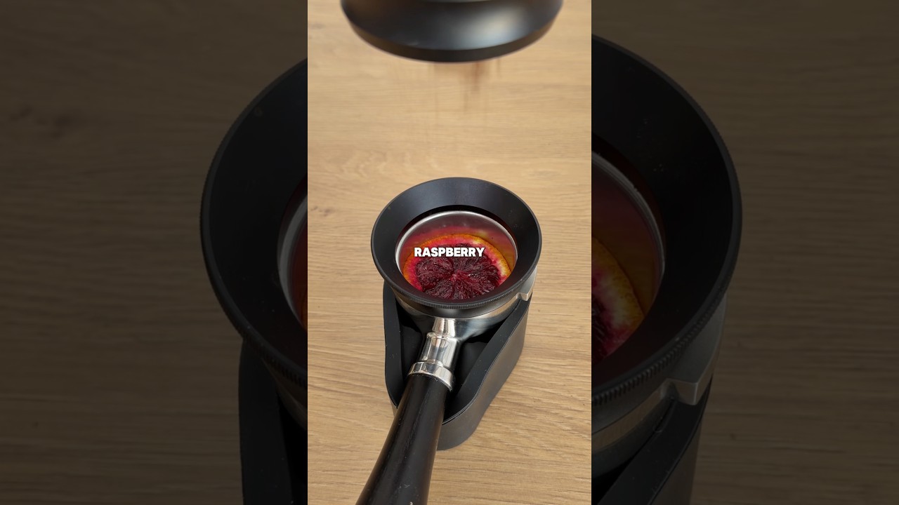 Pulling a shot of espresso through a raspberry orange