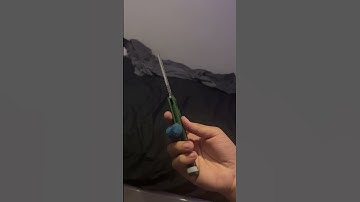 Beginner balisong trick - Sinister’s Roll (slow mo)