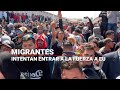 Envivo  urgente miles de migrantes intentan pasar a la fuerza a estados unidos