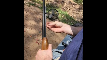 loading old school .22 rifle.