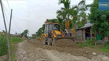 Rough Graveled Road-JCB Backhoe Loader-Leveling the Road