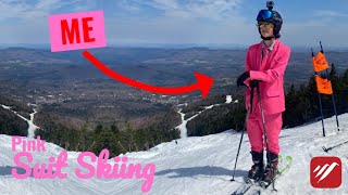 Going skiing in a pink suit.