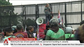 Indonesian drivers gather outside parliament to demand stronger protection for gig workers
