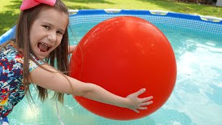 Kids and Mom play with balloons in the pool and learn colors