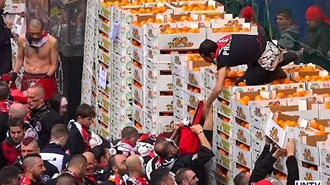 Rival teams battle in spectuacular medieval "Battle of the Oranges"