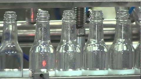 Pressure Overflow filler, working with Glass Bottles, by Acasi Machinery