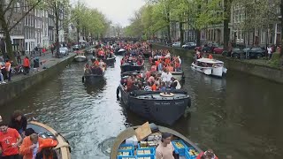 Dutch capital turns orange as revelers celebrate King's Day with colorful canal parade