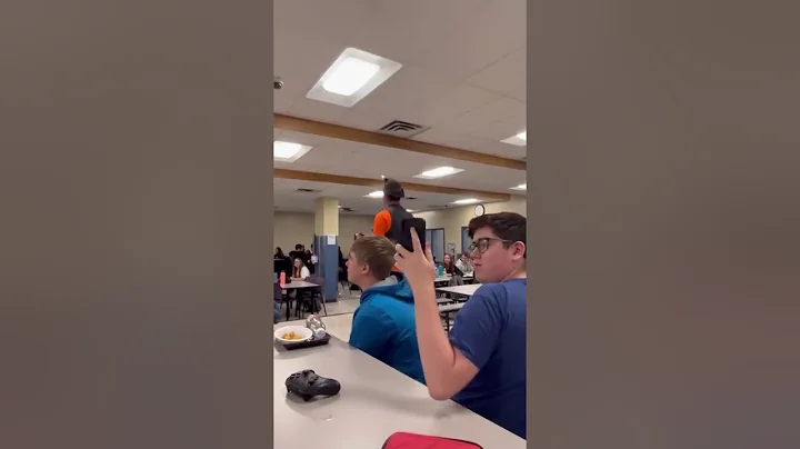 Van cheering on the cheerleaders, football, players, and marching band members for homecoming