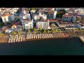 Marmaris, Turkey. Beach management and logistics with organized sunbeds, umbrellas before opening...