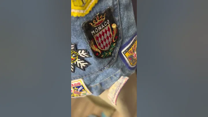 Vintage DKNY denim jacket with tons of travel patches / pins