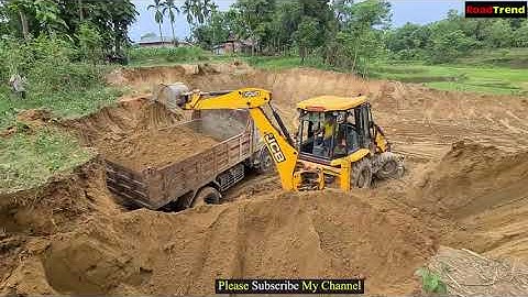 JCB loader machine loading soil in tipper