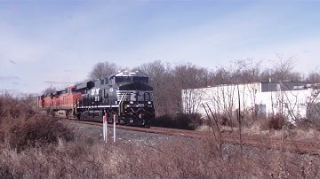 Brand new NS ES44AC leads with two BNSF Dash-9s
