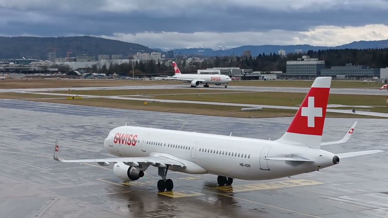 SWISS 777-300ER Takoff on Runway 34 on Zurich Airport.