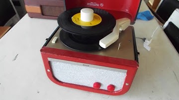 Decca 45 RPM record player playing a stack of 45 records.