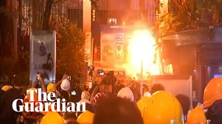 Protesters lit a fire on the steps outside police station in hong kong
as anti-government discontent rumbled on. demonstrators cheered when
blaze outsi...