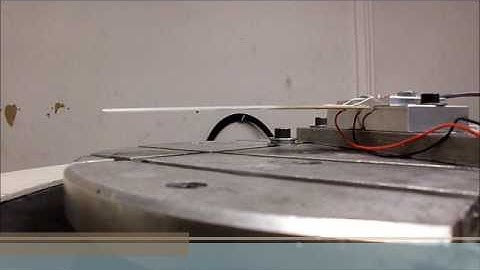 Vibration damping system for a flexible structure using piezoelectric patches