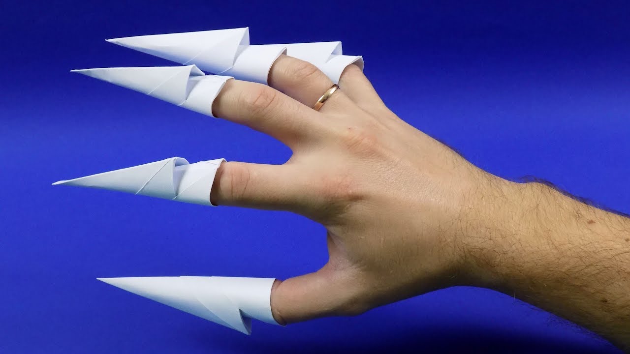 Коготь из бумаги видео. Оригами когти. Когти из бумаги. Бумажные когти на пальцы. Ногти из бумаги.