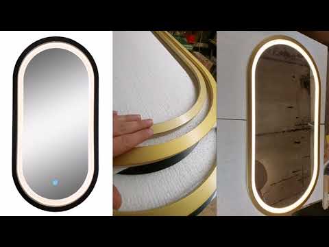 Зеркало - капсула в черной раме и цвета латунь.