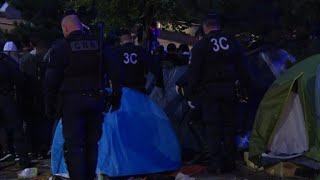Police move over 1,000 migrants from makeshift Paris camp