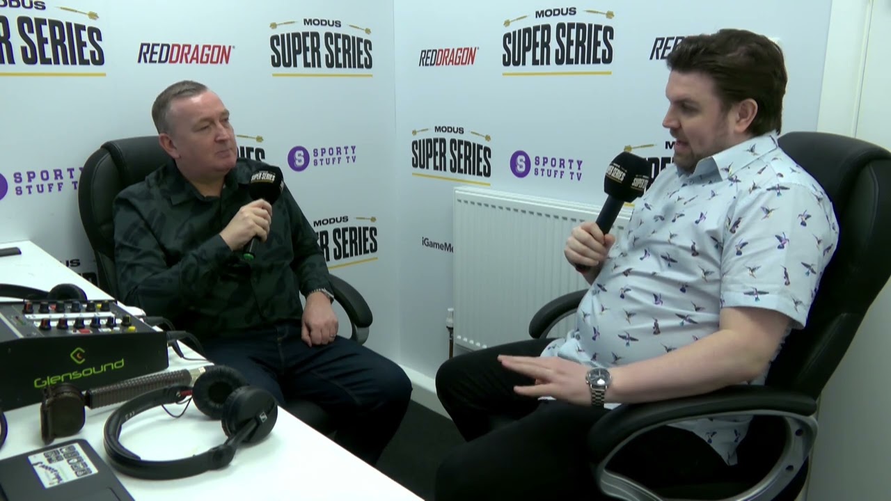 Glen Durrant throwing darts on stage