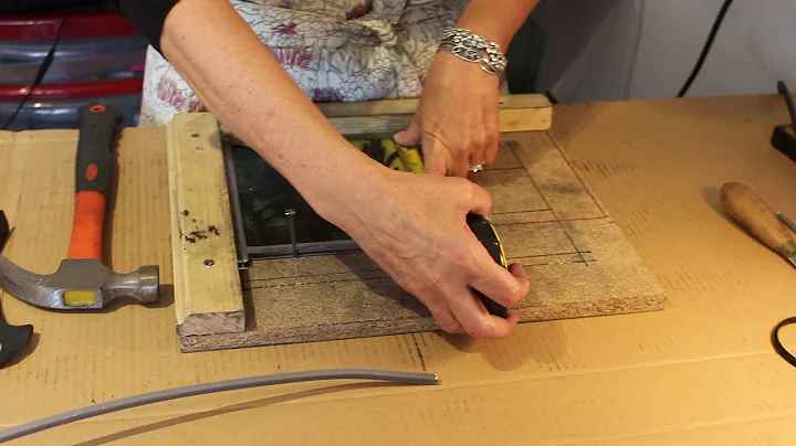 Debra making a glass panel including cutting lead ...