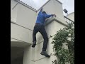 Alex Honnold climbs a building on the AFI campus