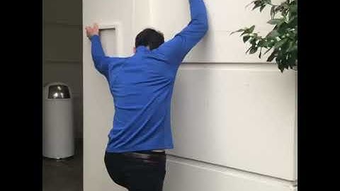 Alex Honnold climbs a building on the AFI campus