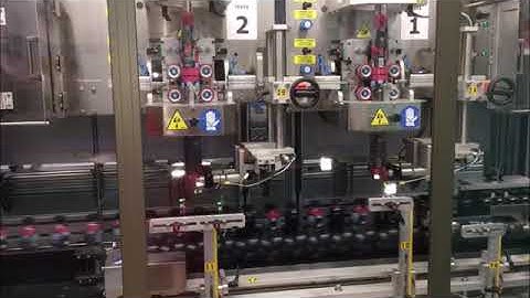 SCALIGERA PACKAGING Sleeve Applicator with Double Head and Steam Shrink Tunnel PET Bottle 48000 bph